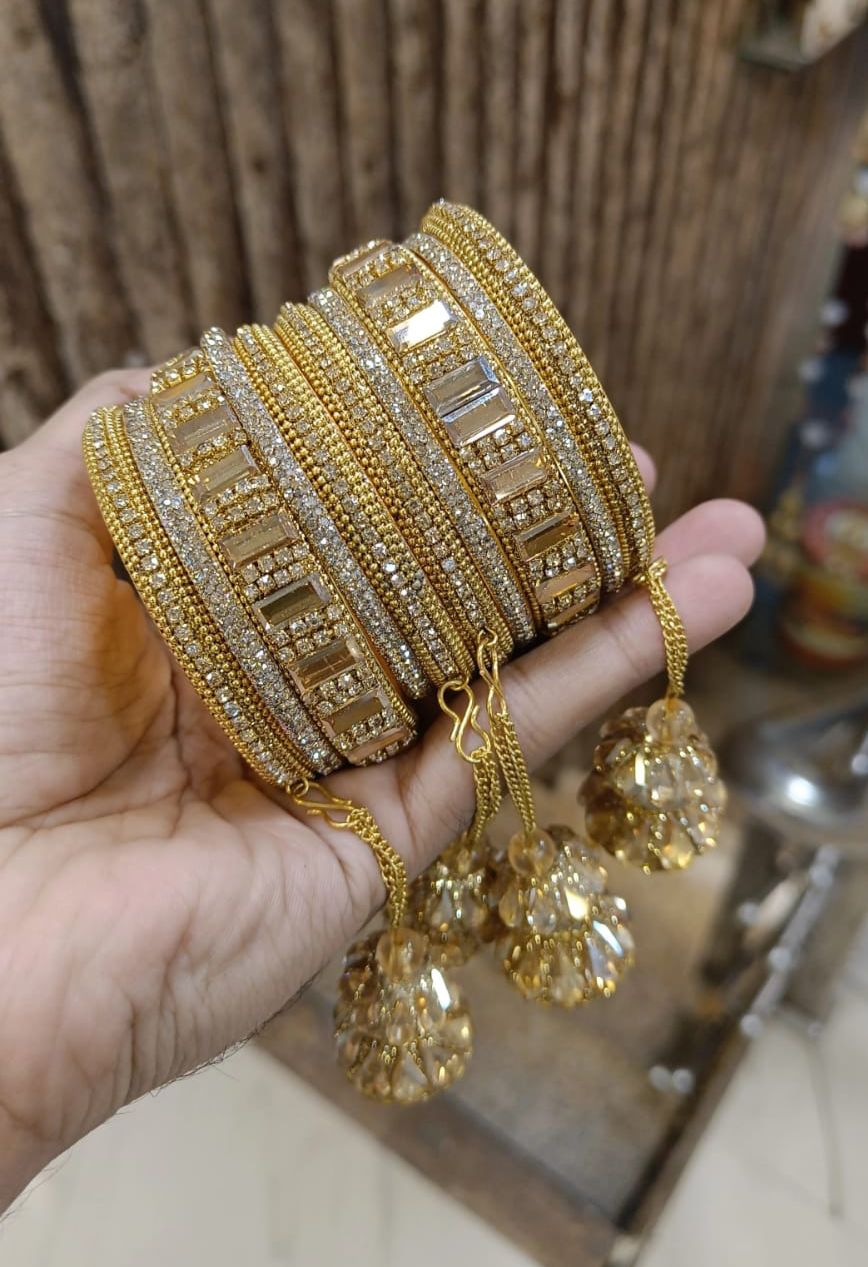 Hainra hanging kundan bangle set